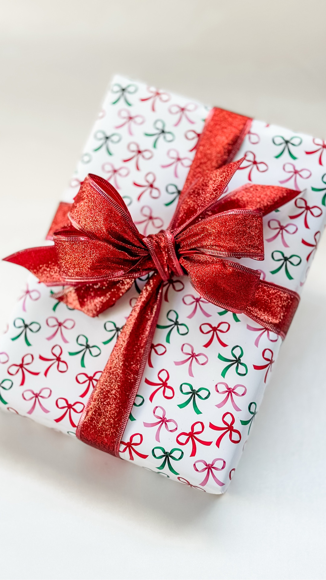 Because one bow just isn’t enough! Wrap with me and learn how to make this easy double bow! 💝 And the best part of all? This glitter ribbon doesn’t shed!

#LTKParties #LTKFindsUnder50 #LTKSeasonal