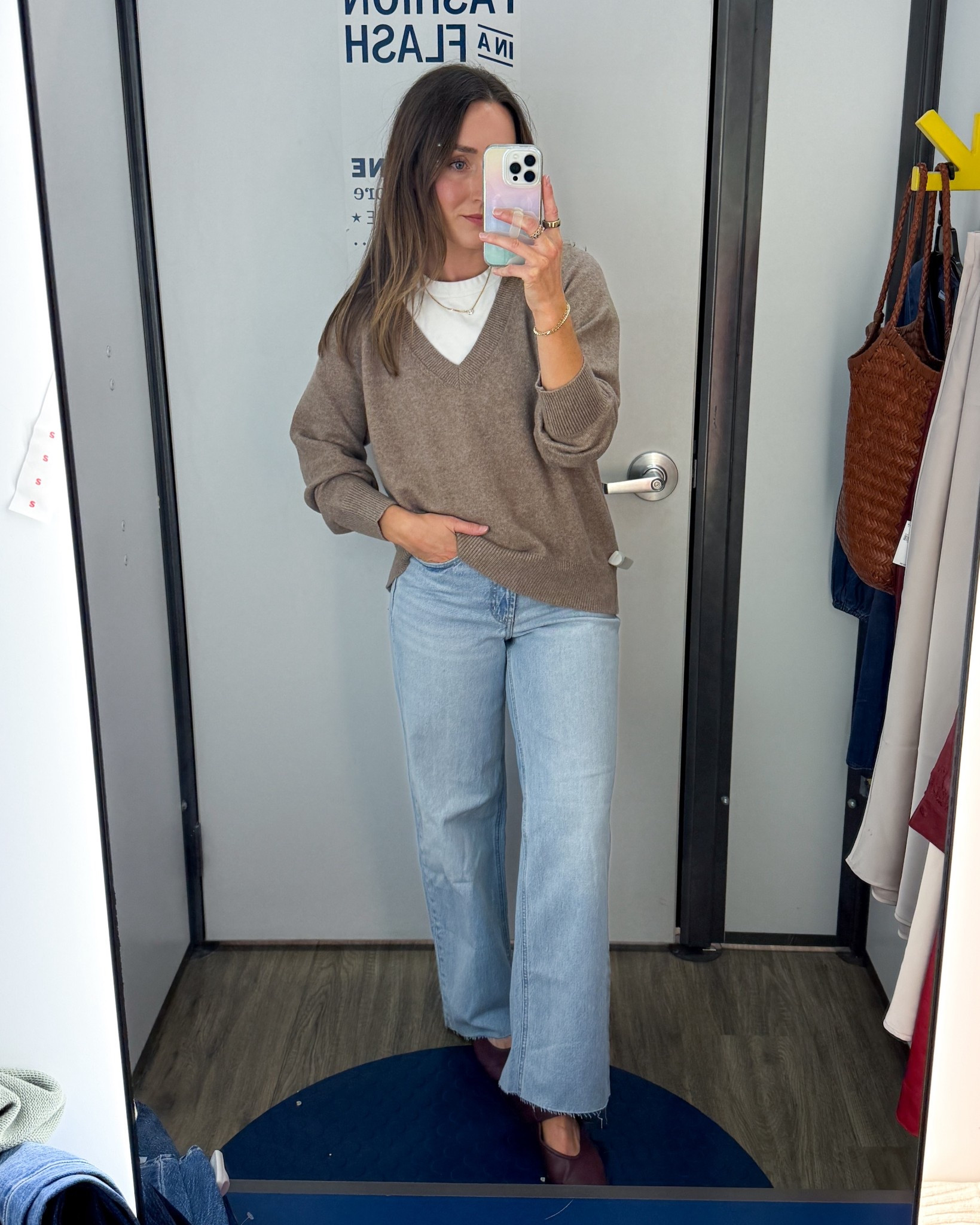 Wearing a small in the sweater and a 0 petite in the jeans. i’ve been wanting to try a crewneck under a V-neck like this.
