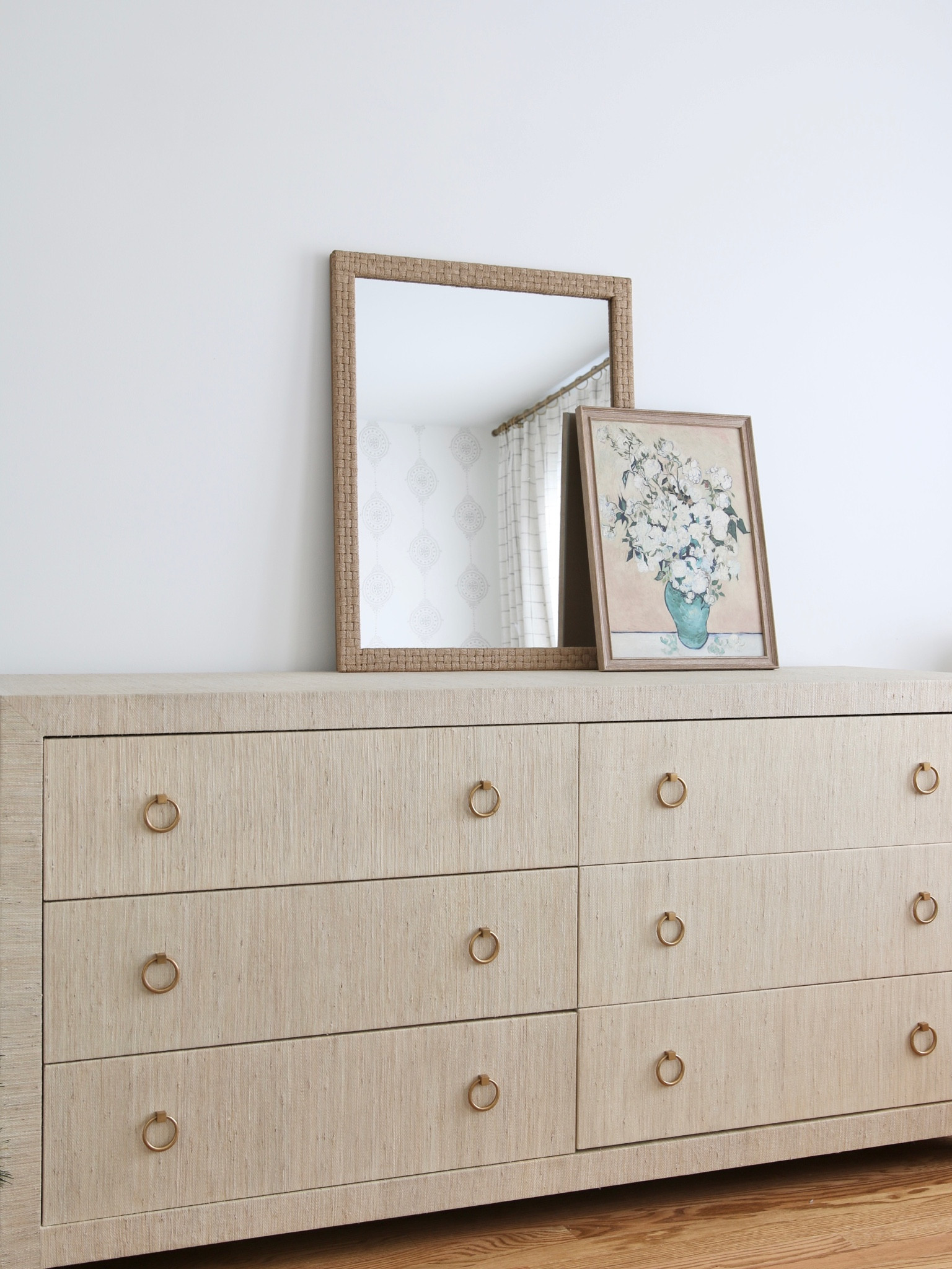 The newest addition to my girl’s room. A wrapped linen 6 drawer dresser from Serena and Lily. On top of the dresser is a woven check mirror and an Avignon Still Life framed wall canvas 

#LTKhome #LTKFind #LTKstyletip