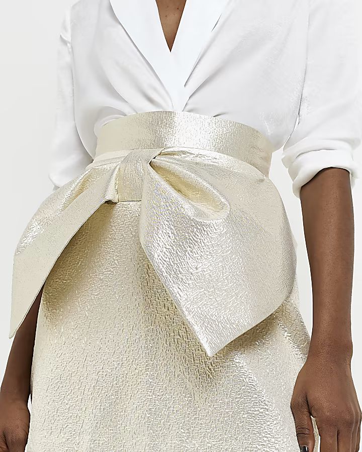 Gold jacquard bow mini skirt | River Island (UK & IE)