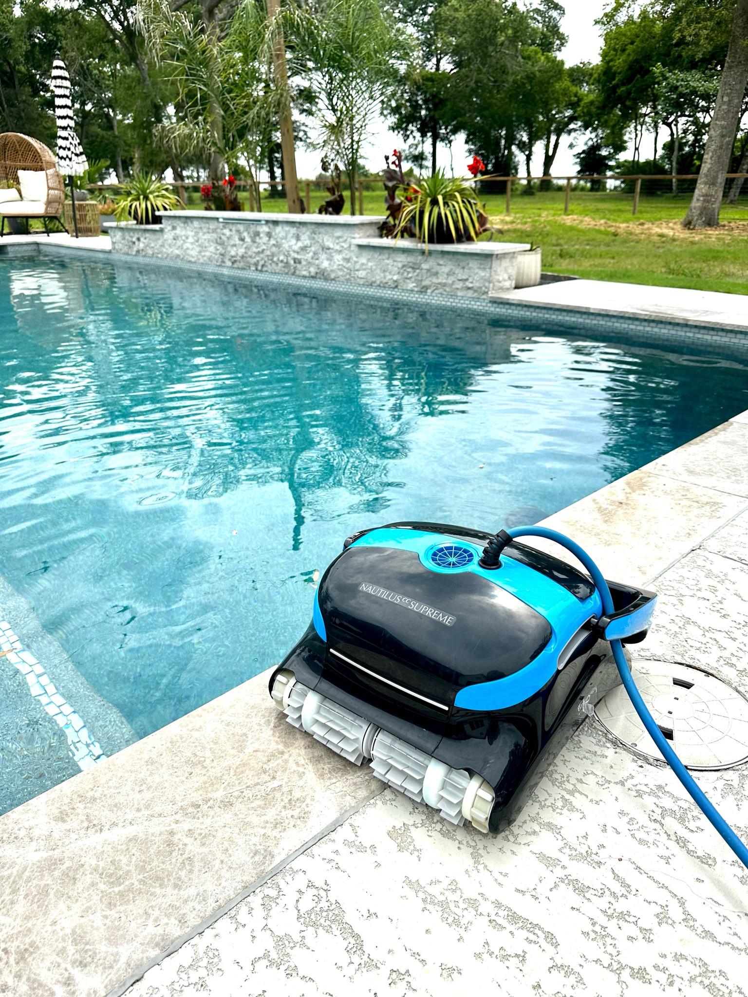 Our nautilus  dolphin robot vacuum! Save your money and get the non wifi option bc it works just as good and it was cheaper. We love the cart for storage too. Climbs walls and cleans the shelf and waterline tile. You can just leave it in the pool and never have to recharge it! 

#LTKhome #LTKSeasonal #LTKswim