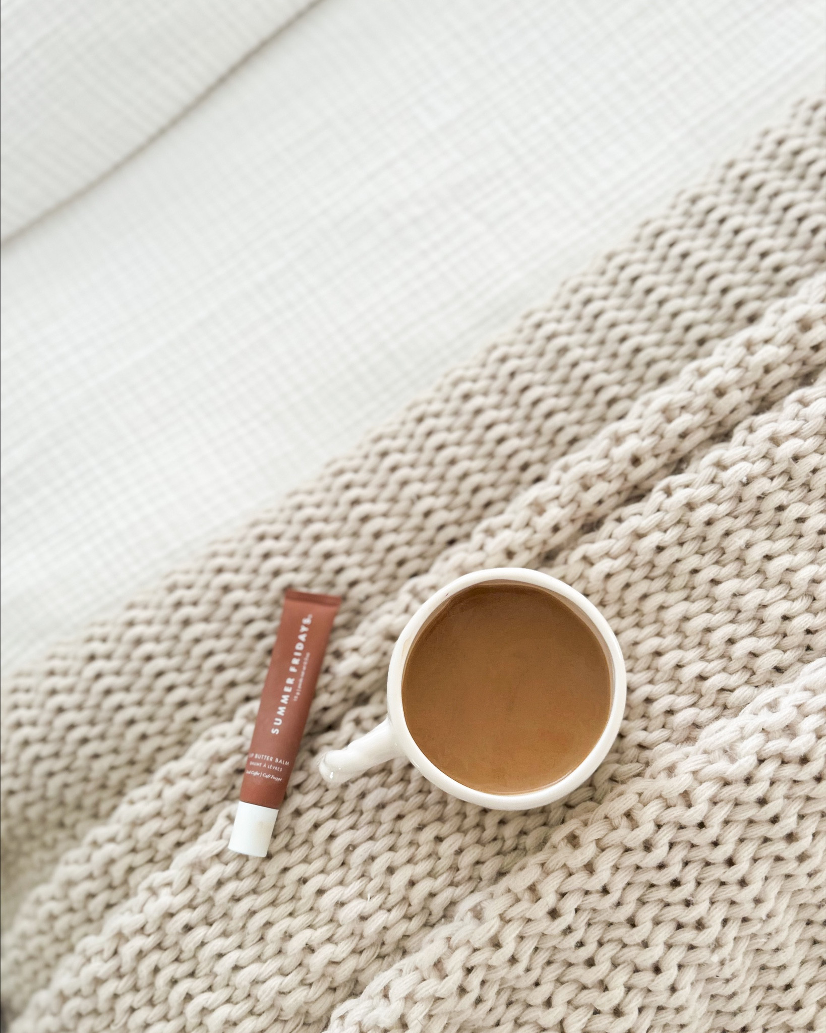 @Summer Fridays Iced Coffee lip butter balm + a hot cup of coffee = the perfect combo. ☕️ 

This duvet cover from @Quince is a dream. ☁️

The knit throw blanket is from @Target 

#LTKStyleTip 

#LTKmorningroutine #LTKBeauty #LTKHome