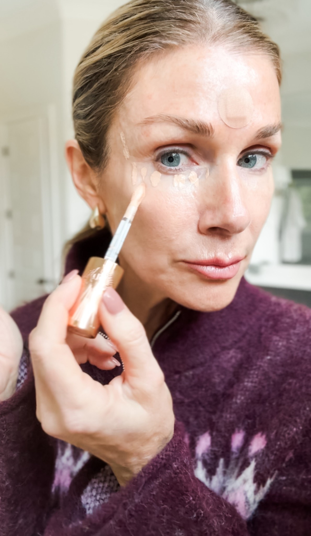 Wearing shade 5 Medium in concealer. Shade 11 in the Fluid Sheet.  Shade SUNRISE in the Tula foundation.  Shade COSTA RICHE in eyeliner 