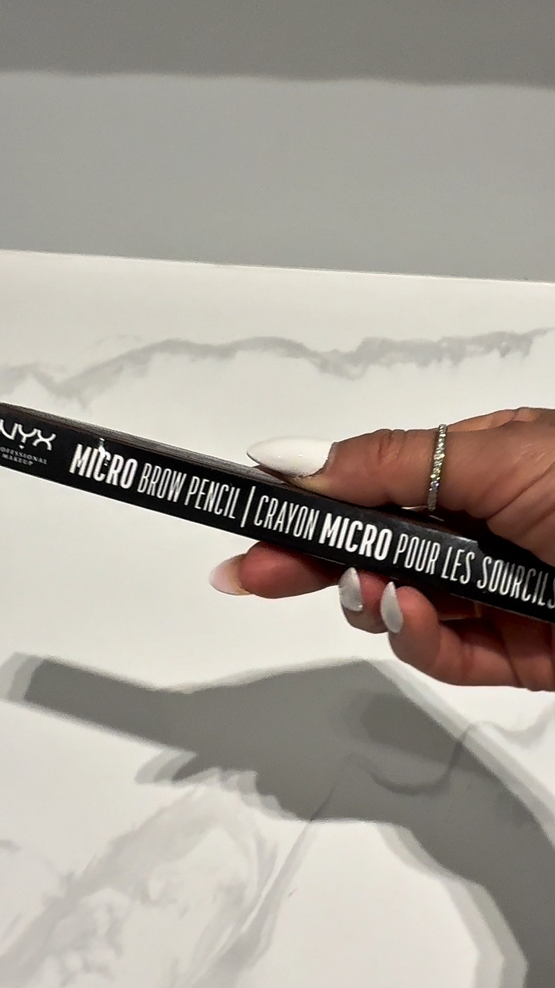The NYX Professional Makeup Micro Brow Pencil is designed for hair-like strokes, making it one of the most searched precise eyebrow pencils for a reason.


Perfect for anyone with sparse brows, over-tweezed brows, or uneven brow tails who wants a natural brow look, not harsh lines. Especially great if you struggle to find a true ash brown eyebrow pencil that doesn’t pull warm or orange.


The ultra-fine tip eyebrow pencil lets you mimic real brow hairs with control. It fills gaps without over-depositing product, which is why it ranks high for natural brow pencil and micro brow pencil.


Fixes patchy brows, thin brows, and uneven arches while keeping brows soft and realistic — not blocky.

Everyday makeup, no-makeup makeup, workdays, errands, travel, and quick morning routines.

Application + wear notes:
Smooth, buildable formula that’s easy to apply and blend with the spoolie. For longer wear, set with clear or tinted brow gel.

If you want defined but natural eyebrows on a budget, this is one of the most reliable brow pencils you can keep repurchasing.


micro brow pencil, precise eyebrow pencil, natural brow pencil, ash brown eyebrow pencil, eyebrow pencil for sparse brows, hair like brow strokes, NYX Micro Brow Pencil
