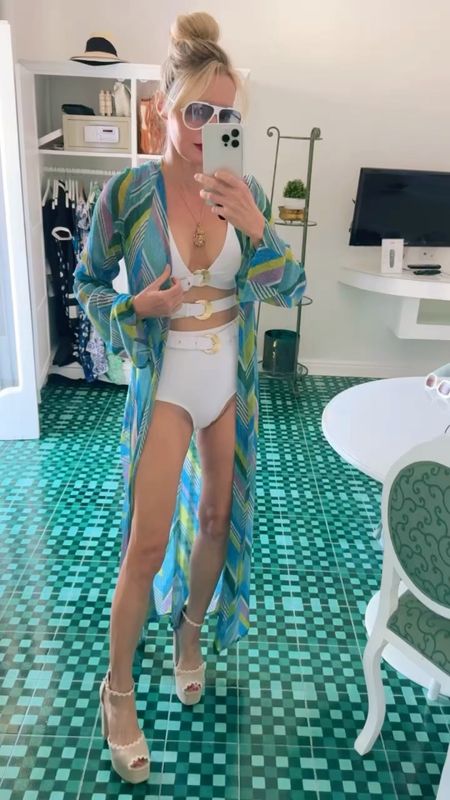 My poolside #ootd in Positano, Italy. This OYE white bikini set is so unique and cool. I love the gold buckle detailing. Fit runs true to size. And then this long sleeve coverup is a real show-stopper! It’s a new favorite of mine! 

~Erin xo 

#LTKSwim #LTKTravel #LTKSeasonal