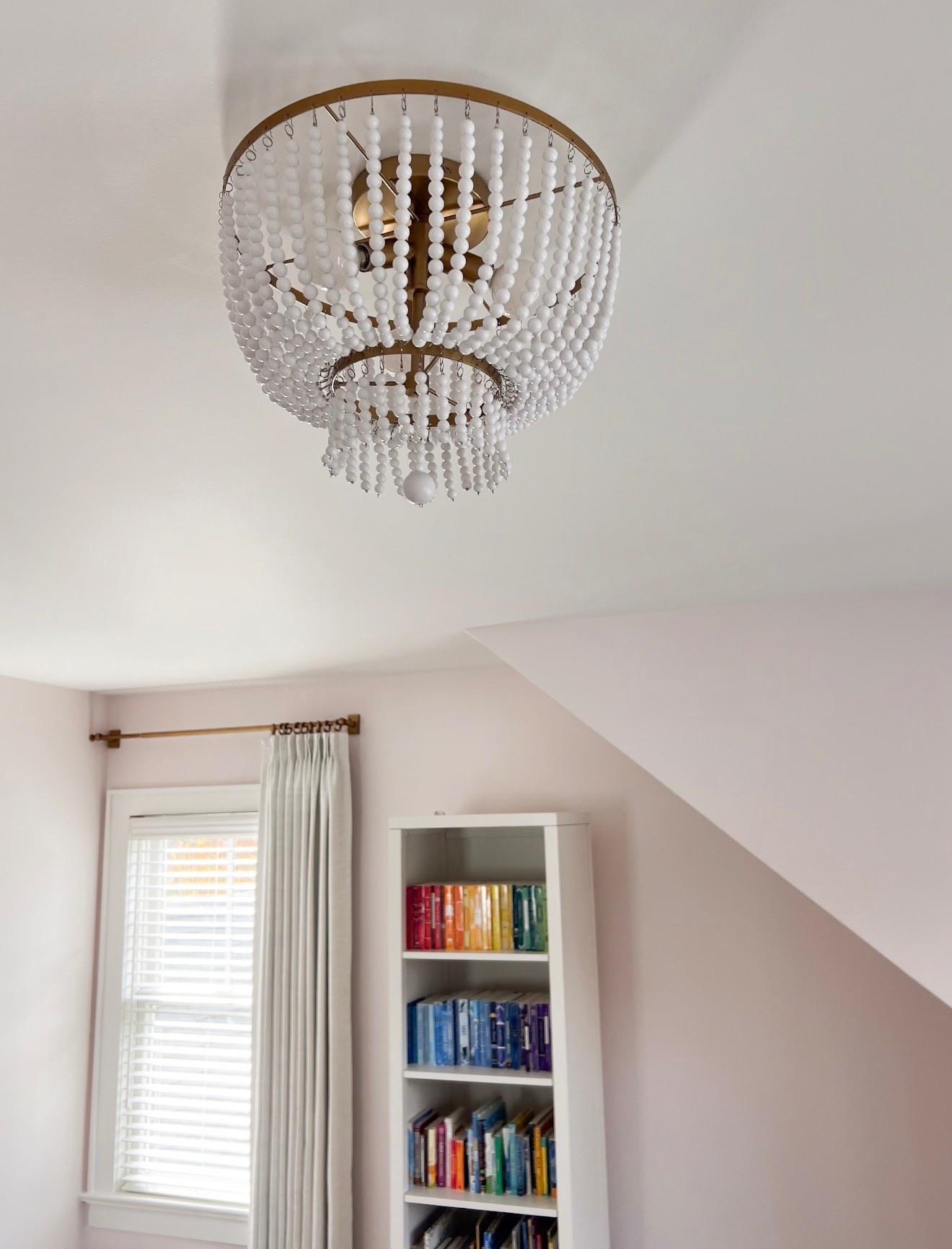 A cute corner of a little girl’s bedroom that I designed 🩶 

A pretty low-maintenance rug, my go-to custom curtains, the cutest house bookcase and a statement chandelier! 

#LTKSaleAlert #LTKHome #LTKKids