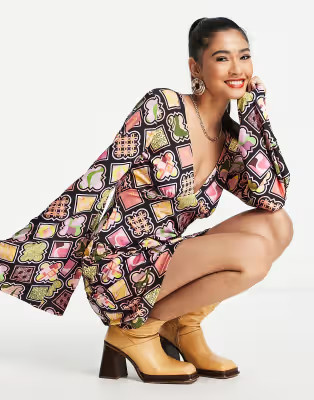 ASOS DESIGN slinky flare sleeve mini dress in black retro print | ASOS (Global)