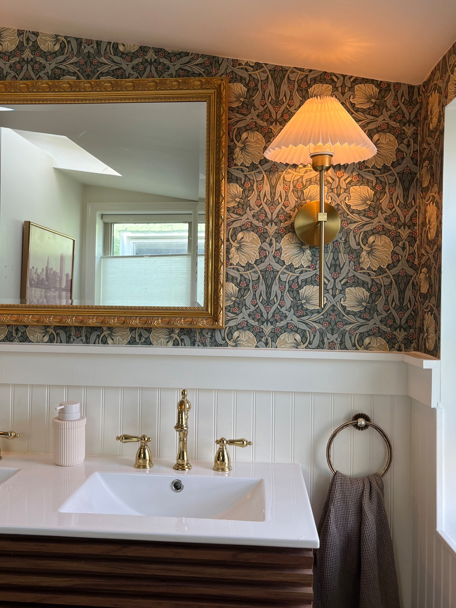 this bathroom wallpaper always makes me so excited for spring weather ✨🌺 

bathroom wallpaper, vintage vanity, gold faucet, vintage bathroom, gold hardware, cozy bathroom 

#LTKSeasonal #LTKHome