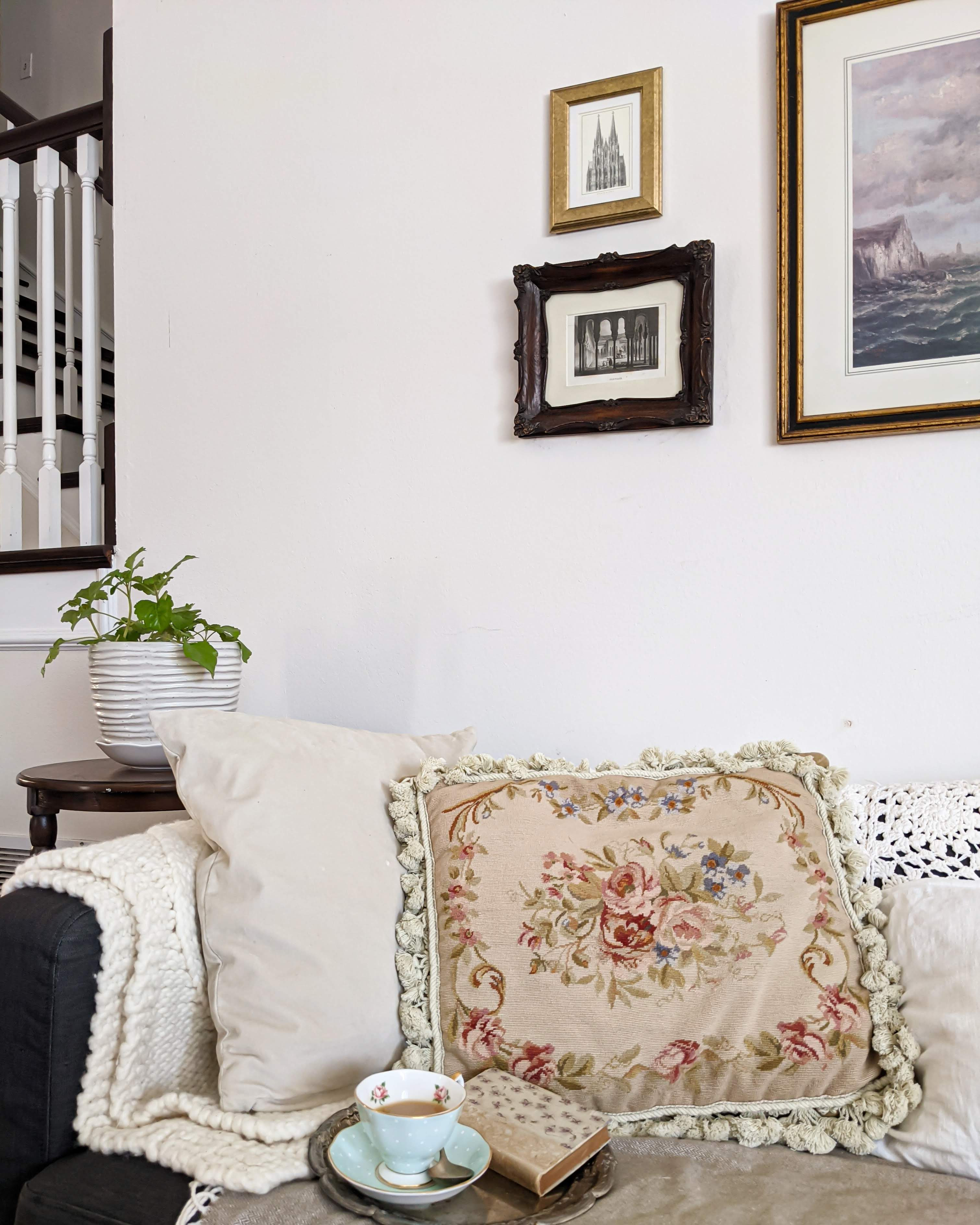 A cozy cottagecore corner full of tea, good books, and a needlepoint pillow. 

 #LTKHome #LTKFindsUnder50 #LTKFindsUnder100