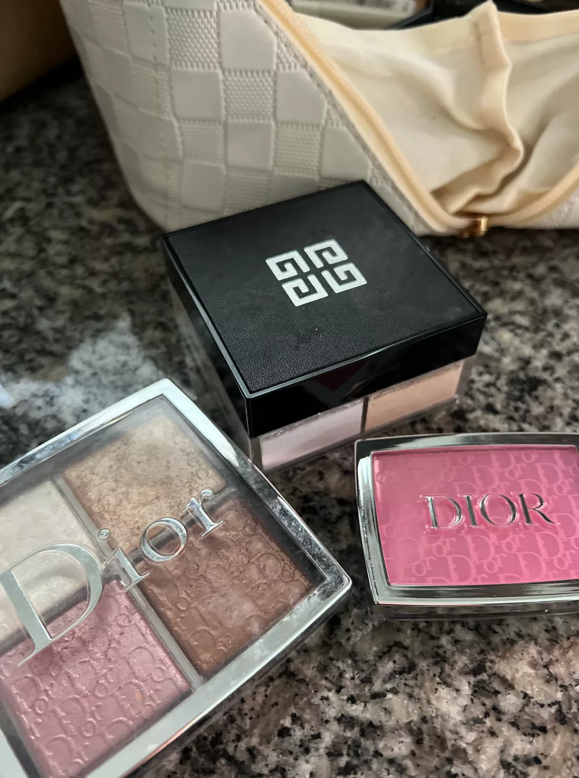 3 Makeup Products in a Dior Pouch
