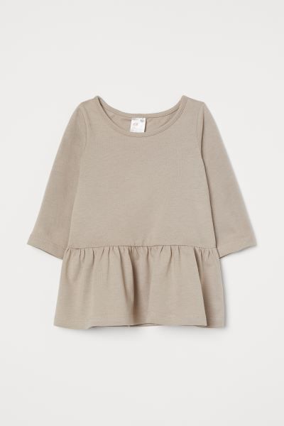 Long-sleeved dress in soft, organic cotton jersey with a round neckline. Seam at hem with wide fl... | H&M (US + CA)