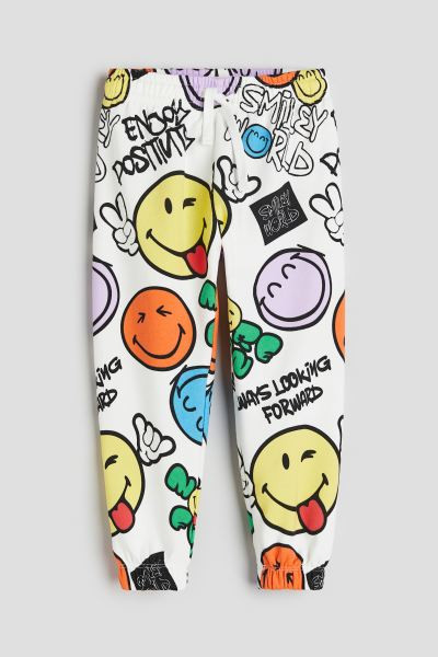 Patterned Joggers - White/SmileyWorld® - Kids | H&M US | H&M (US + CA)