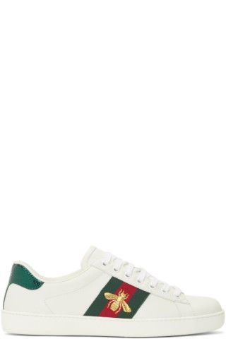 Low-top buffed leather sneakers in white. Round toe. Tonal lace-up closure. Signature striped web... | SSENSE 