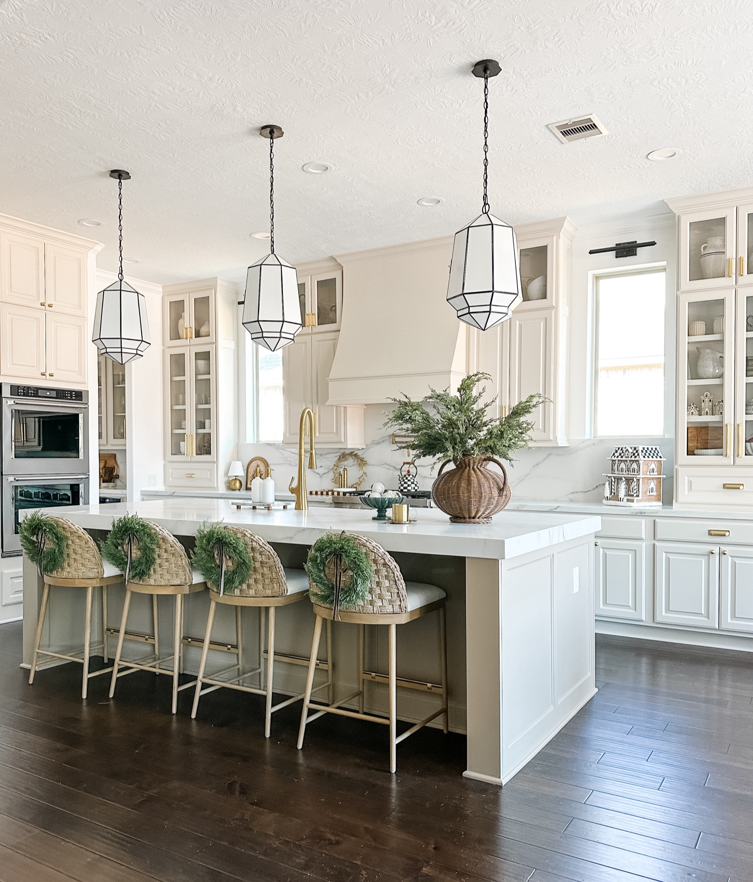 Holiday kitchen styling. The mini wreaths are my favorite touch. The beautiful Mackenzie-Childs ginger bread house is also such a cute addition!! All the kitchen details are included - kitchen pendants, cabinets hardware, and all decor. 

👉👉 Use code MARIANA20 for 20% off your first order for the next 48 hours on anything from MacKenzie-Childs. 

#LTKHoliday #LTKSaleAlert #LTKHome