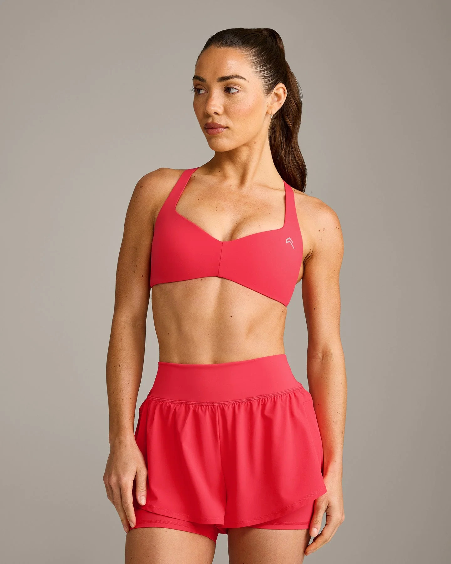 UnifiedMove\u2122 T Back Minimal Bralette with Reflective Logo 
 Charged Pink | Oner Active (UK / US)