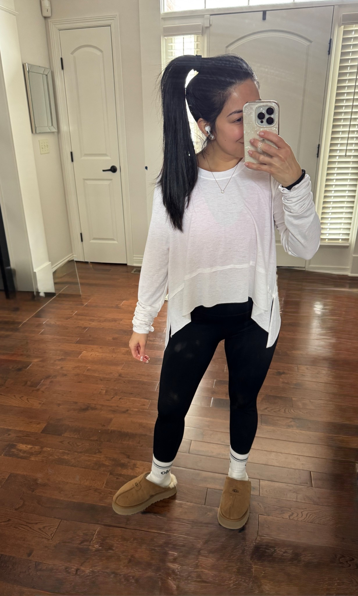 Today’s workout outfit that I wore to barre class 
Workout look. 
Activewear. 
Sweatshirt - lululemon size 6 TTS (black)
long sleeve shirt - FP Movement size S TTS (optic white)
Sports bra - FP Movement size S TTS (red)
Leggings - volare size S TTS (my favorite workout leggings so far)
Socks - alo (smallest size)
Slippers - Uggs size 6 (sized up 1)

#LTKPetite #LTKActive #LTKfitnessgoals