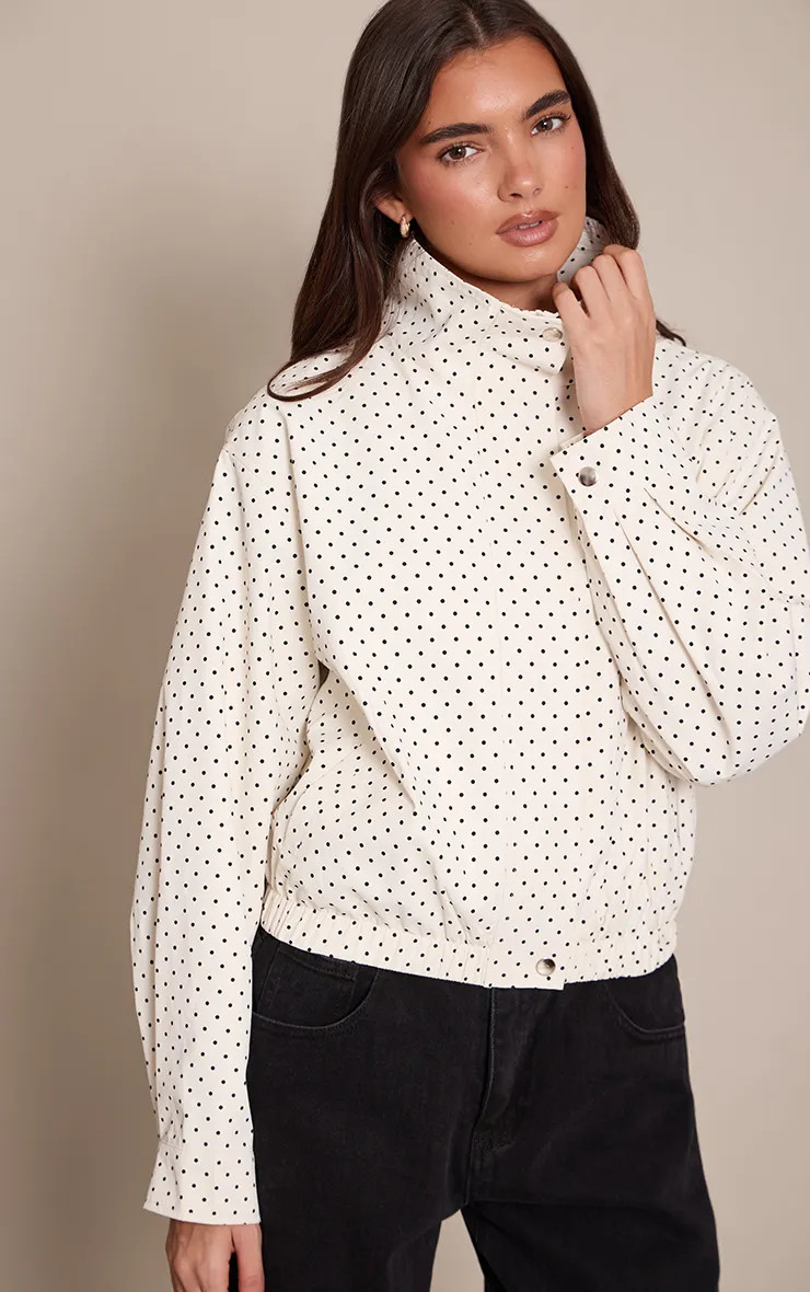 PrettyLittleThing Cream Polka Dot High Neck Windbreaker | Boohoo | Boohoo.com (UK & IE)