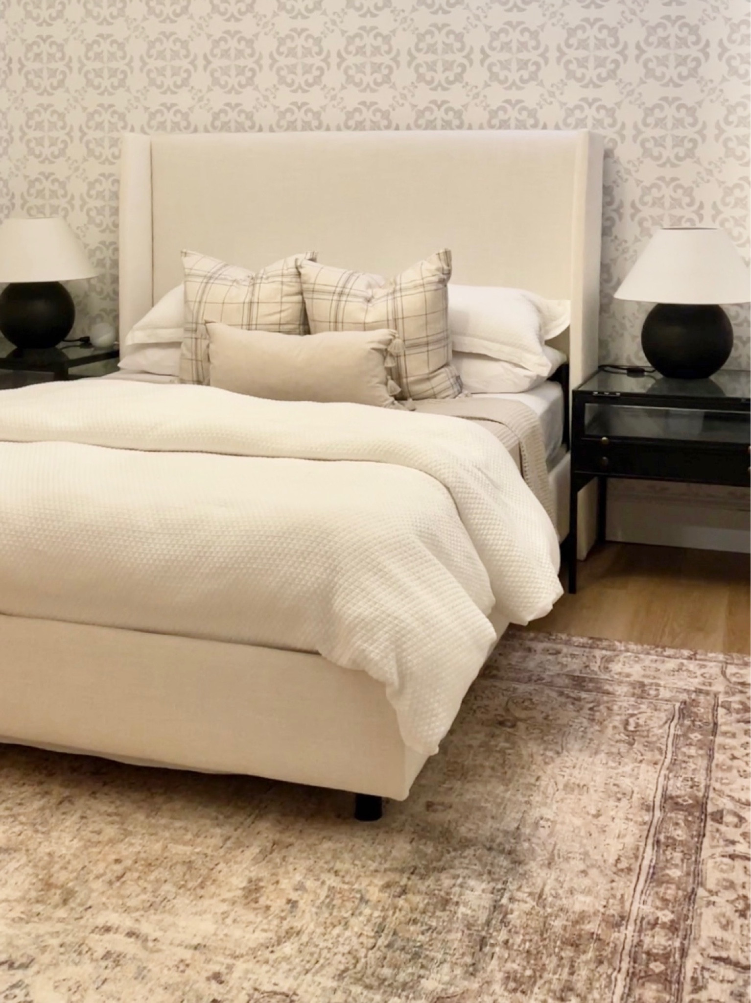 This is the current decor in my basement guest bedroom. 
I updated the rug with a Loloi II Margot rug. 
The rest of the room includes a low profile upholstered bed, ceramic table lamps, black iron and glasses nightstands, linen sheets and a chunky knit throw blanket 

#LTKFind #LTKhome #LTKstyletip
