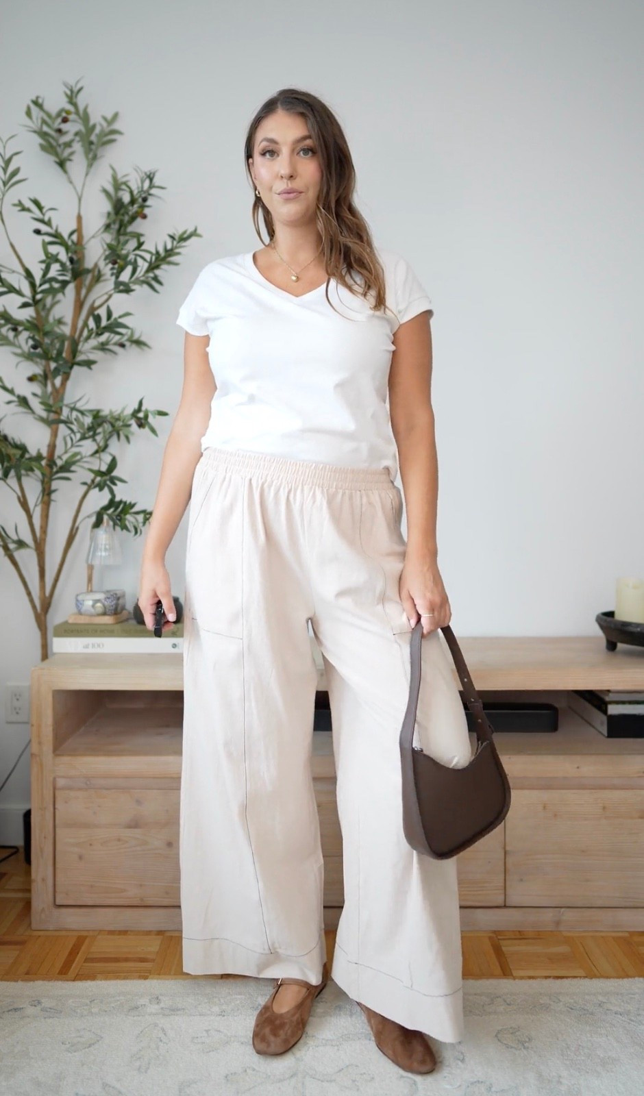 Neutral dressing for fall 🤎 Cream wide-leg pants styled with a classic white tee, chocolate suede flats, and a brown shoulder bag. The perfect mix of comfortable and polished for an easy everyday outfit.

neutral fall outfit, cream pants, wide leg pants, white tee, brown flats, chocolate brown, casual fall style, elevated basics

#LTKmomlife #LTKSeasonal #LTKTall
