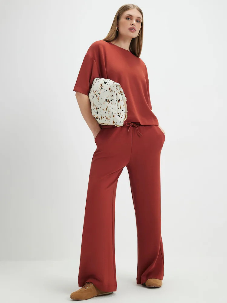 Buy River Island Orange Premium Swash Wide Leg Joggers from Next Belgium | Next EU
