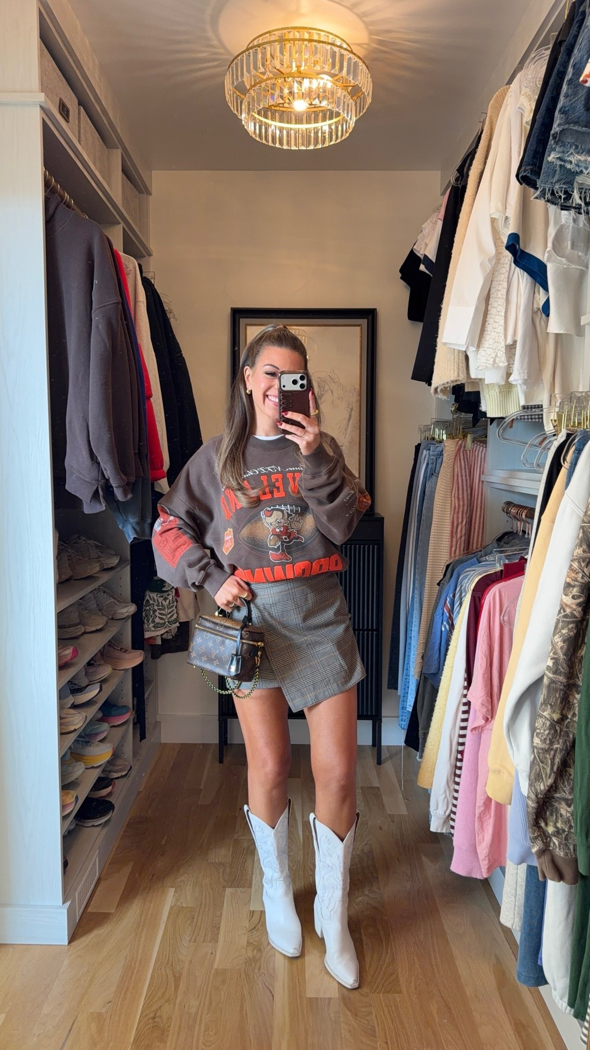 old navy mini wrap skirt for $28 with online discount styled with brown oversized football graphic crewneck sweatshirt and white western boots 🫶🏻

Sizing: i'm 5'4" and typically wear a small/2
xs petite skirt 
large sweatshirt 

vici: emerson35
Revolve code: tulip

Fall transitional, Fall event, Workwear, wrap skirt, Chunky sweater, Mesh top, oversized sweatshirt, faux fur jacket, black boots, suede boots, leather boots, brown boots