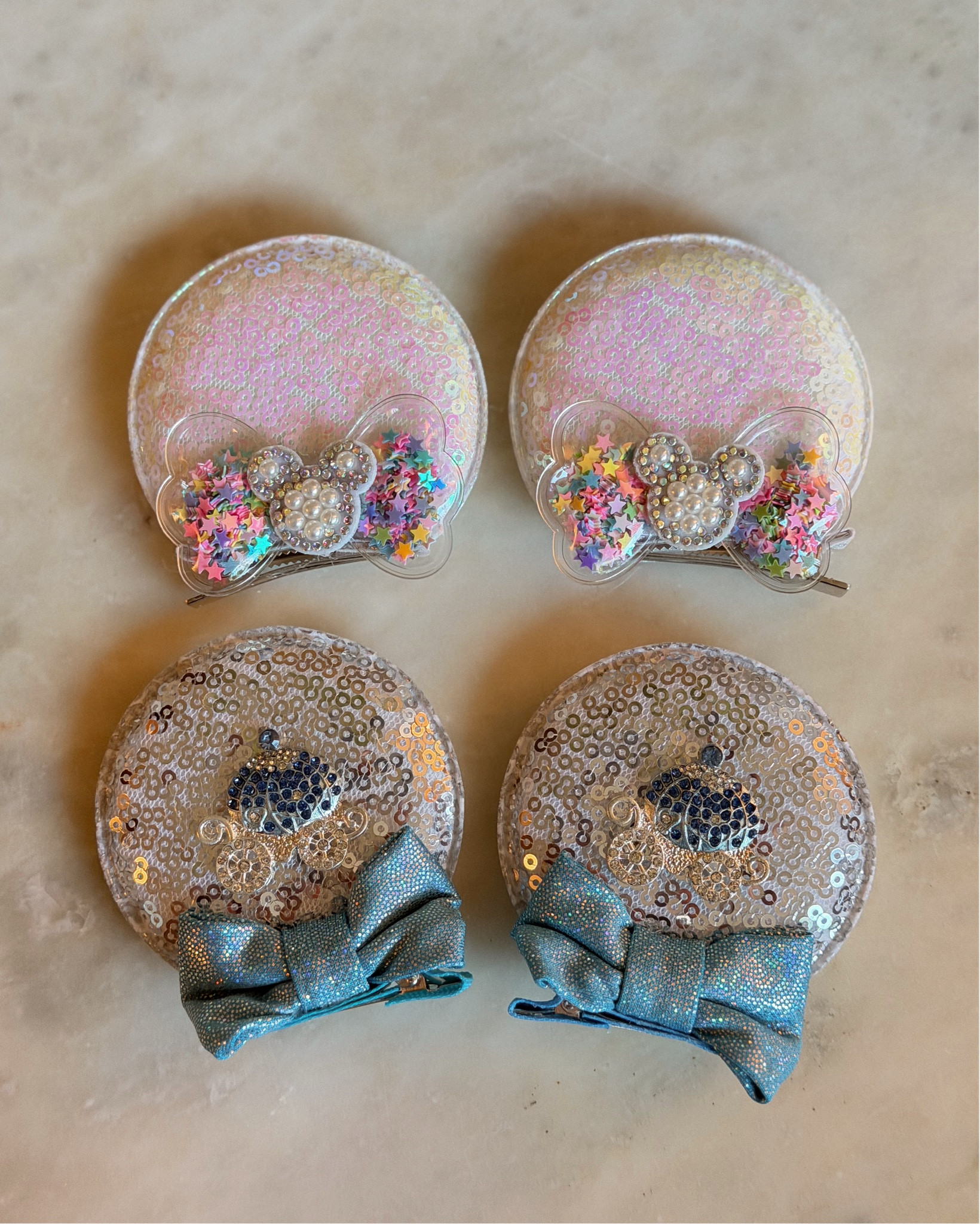 Last min delivery for Evie!!! So thankful these came in time. Her clip ears arrived and I’m so glad she has these colors for her outfits. The Cinderella ones kill me 🥹🩵 

Disney, Disney ears, toddler Disney ears, Minnie Mouse ears, Minnie’s clips 

#LTKKids #LTKmomlife #LTKTravel