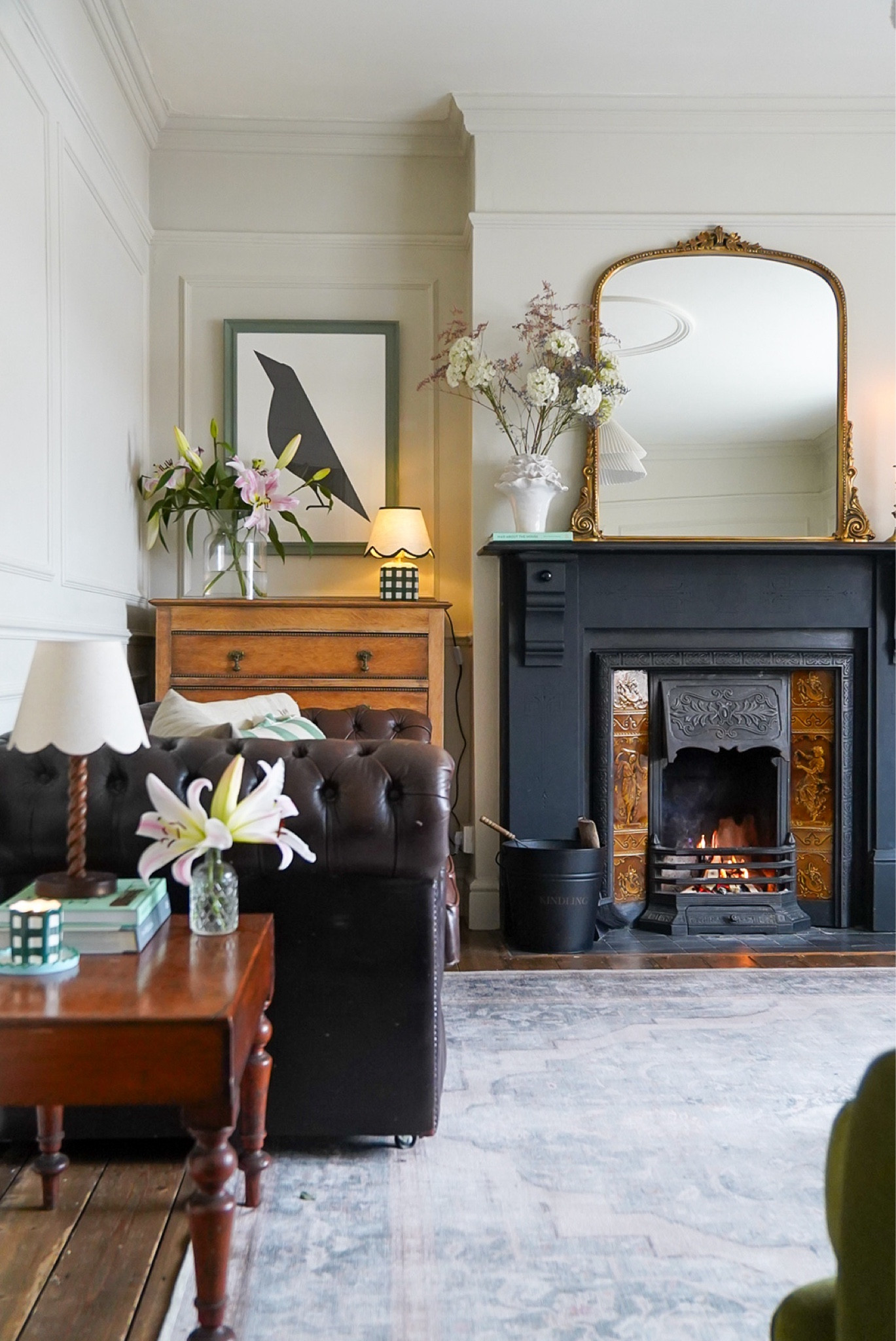 Living room decor 

Large gold anthropology mirror 
Bird print 
Table lamps
Washable rug 

#LTKeurope #LTKhome