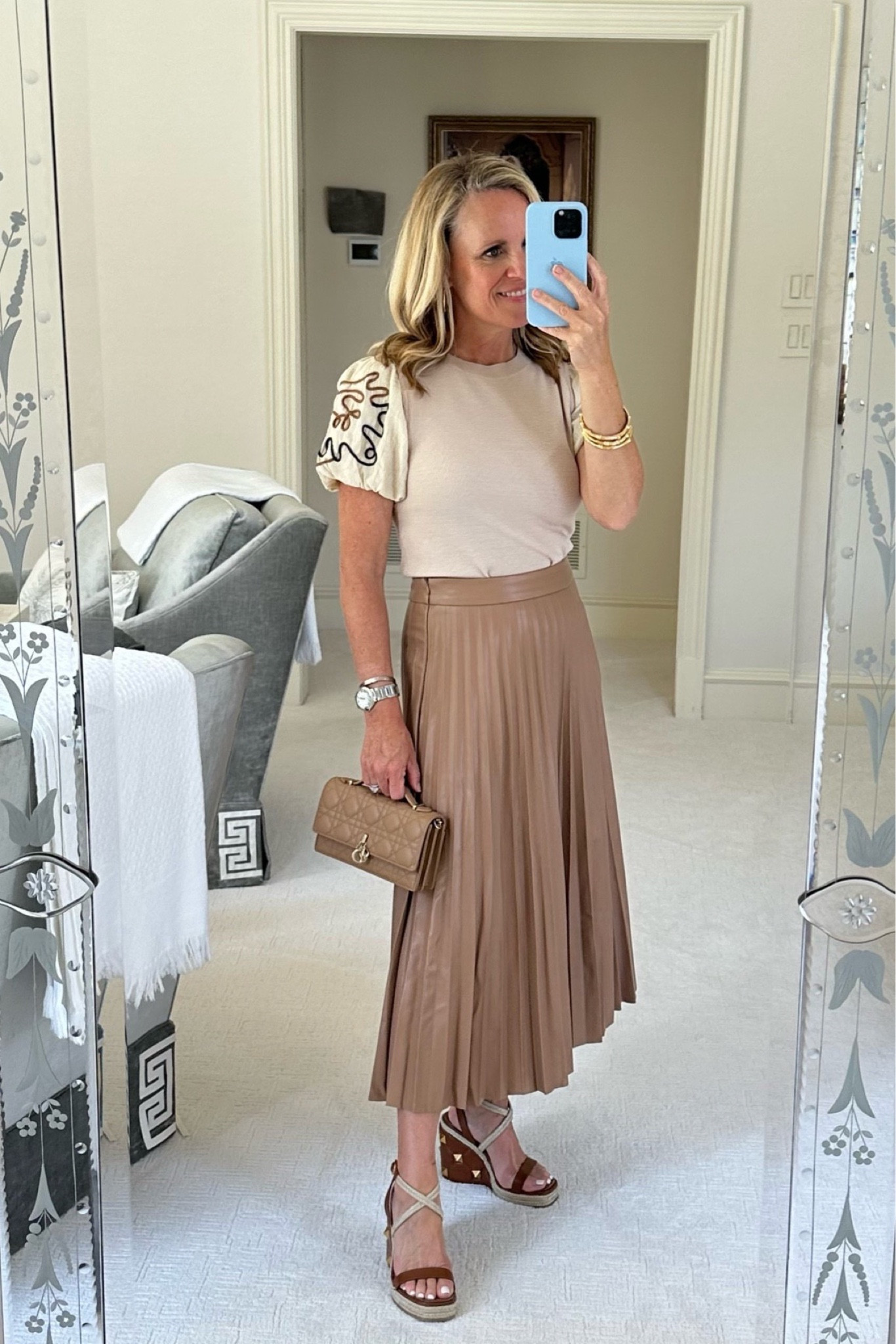 The details are everything in this gorgeous faux leather accordion pleat skirt and intricate embroidered short sleeve sweater

Camel Faux leather accordion pleat skirt 
Ivory sweater with puff sleeve, and tan and teal embroidery 
Both fit true to size I am wearing extra small  in sweater available and extra small through large
I’m wearing size small in the skirt available small medium and large 
I’m 5’2” tall 

#LTKstyletip #LTKfindsunder100 #LTKSeasonal