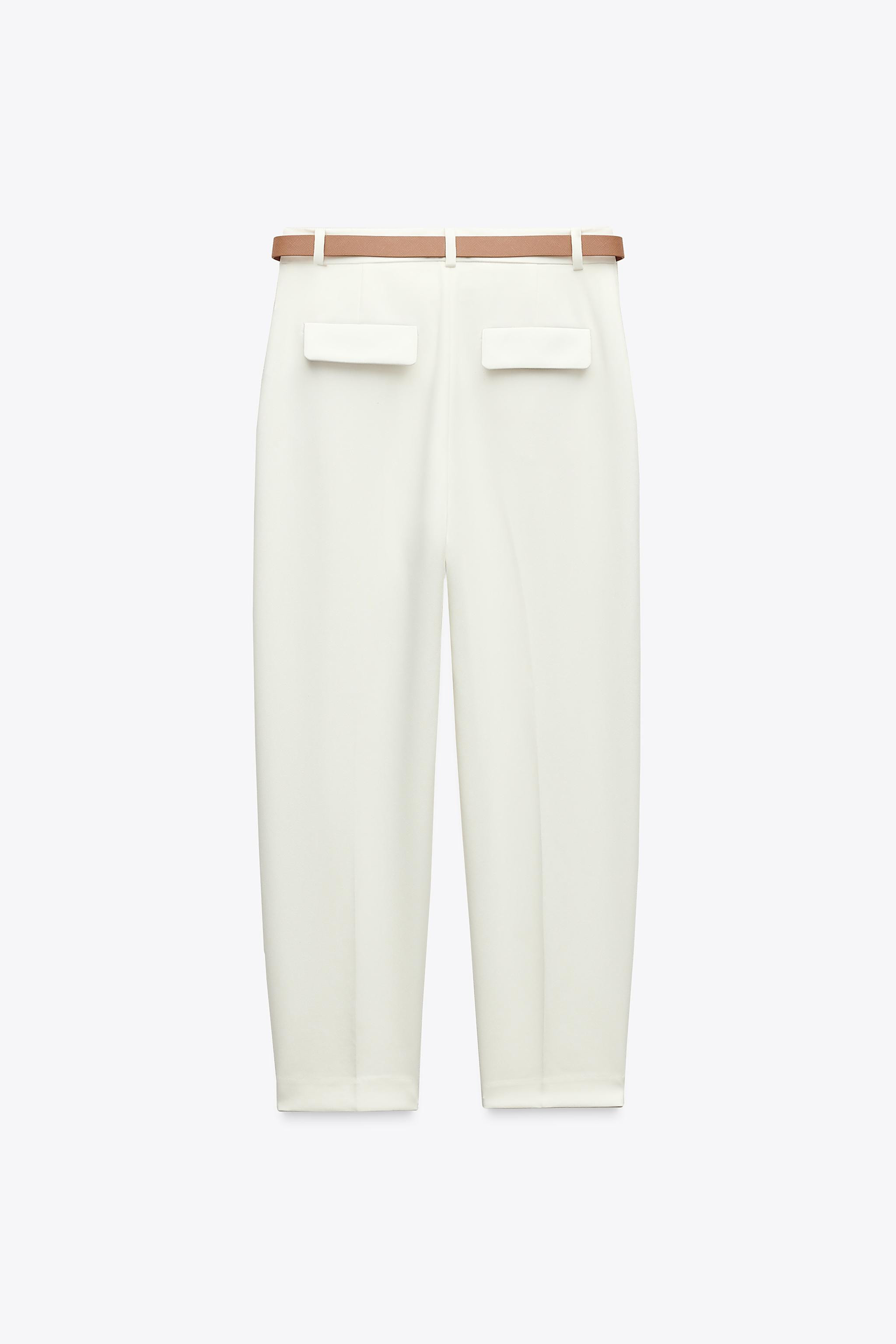 High-waist ankle-length trousers with front darts and a belt. Front pockets and false flap pocket... | Zara UK