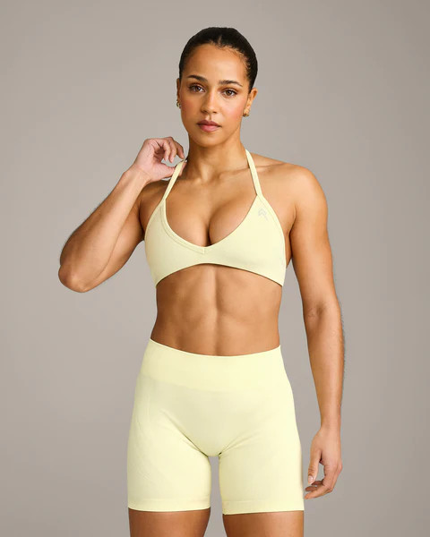 EnhanceLift™ Seamless Minimal Halter Neck Bralette with Gray Logo 
 Pastel Yellow | Oner Active (UK / US)