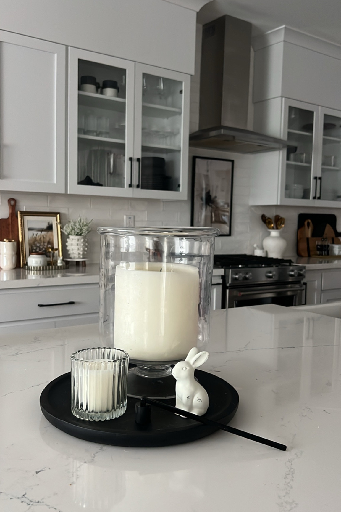 Spring kitchen counter decor, large candle holder, spring tray, decor

#LTKSeasonal #LTKHome