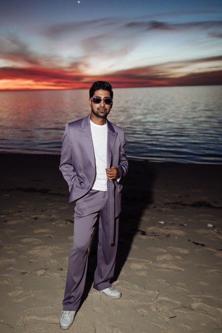 Make a statement, even at the beach. The vibrant purple hue of this suit commands attention, while the stunning sunset backdrop adds a touch of sophistication. Who says you can't look sharp in casual settings? 

#LTKFestival #LTKFind #LTKmens
