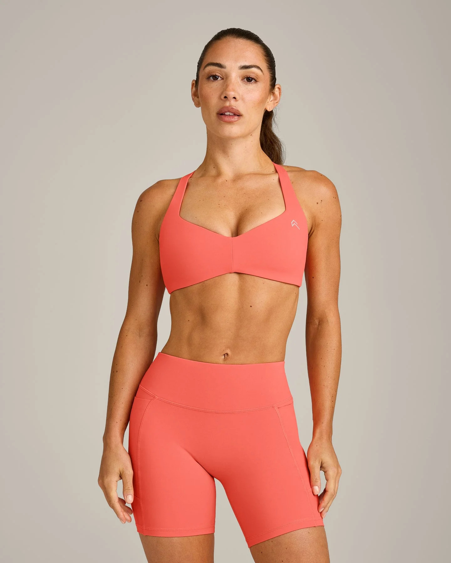 UnifiedMove\u2122 T Back Minimal Bralette with Reflective Logo
Light Charged Coral | Oner Active (UK / US)