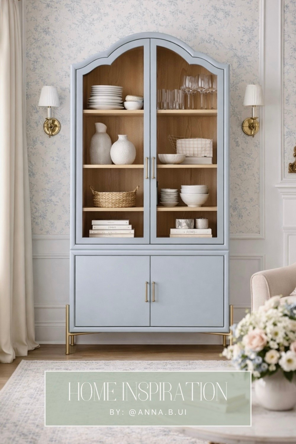 On my wishlist! 🩵 The Livia Glass & Wood Storage Hutch from Anthropologie in this soft light blue is such a beautiful piece. I love the elegant frame, arched detailing, and gold knob accents—those little touches make the cabinet feel so timeless and refined. ✨ Perfect for displaying favorite pieces behind the glass while still offering hidden storage below to tuck things away. A truly stylish hutch that would elevate any dining room or living space. Linked it here along with other beautiful cabinet finds! ☺️ #AnthropologieHome #DisplayCabinet 
#HomeInspo

#LTKSaleAlert #LTKHome