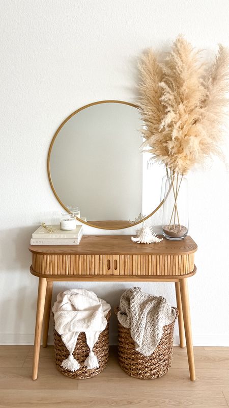 Summer entryway table decor - round gold mirror, glass vase, pampas grass, conch shell, neutral coffee table books, candle, gold candle wick trimmer, slatted wood console table, woven baskets, throw blankets

// #ltkseasonal #ltkfind #ltkhome #ltkstyletip #ltkunder50 #ltkunder100 home decor, boho home, neutral home, summer decor, coastal home, table decor, coffee table books, entryway table, entryway decor, hallway, furniture, Target, Target home, Amazon, Amazon home, Amazon finds