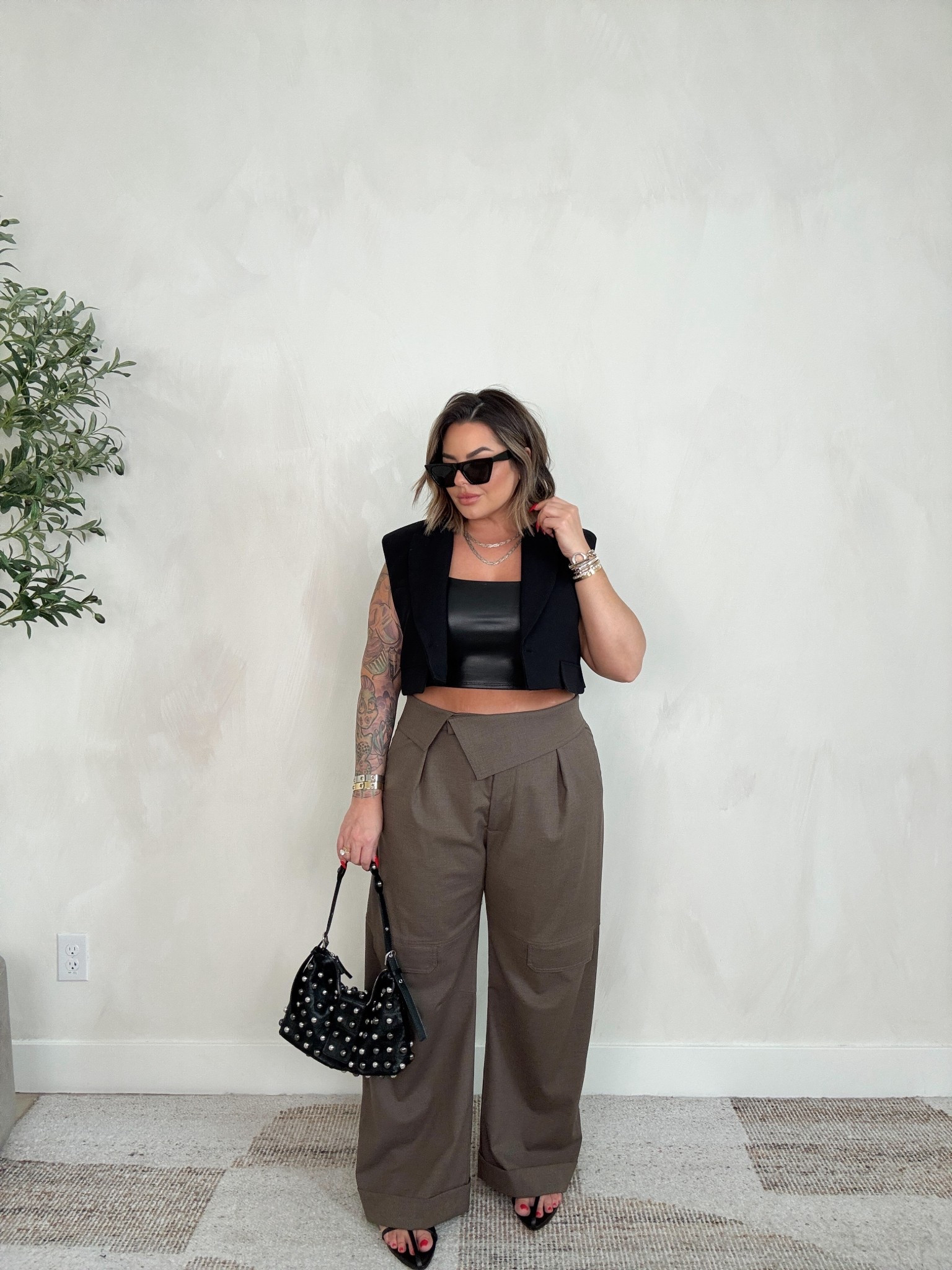 Pants xl
Sadly the blazer vest is now sold out I linked anyways incase it comes back. 
Exact leather tank is old linked similar options. 

I also linked similar tops that would be cute with these pants 