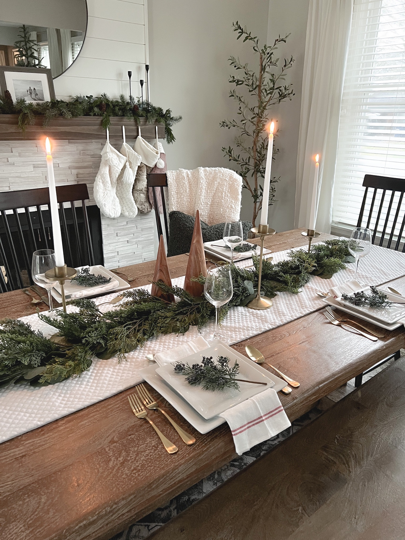 Holiday tablescape Christmas tablescape christmas placesetting holiday table holiday centerpiece Christmas centerpiece Christmas dining room holiday dining room Christmas table Christmas garland taper candles taper candle holder candlestick holder white dinnerware gold utensils Christmas stockings 

#LTKstyletip #LTKHoliday #LTKsalealert