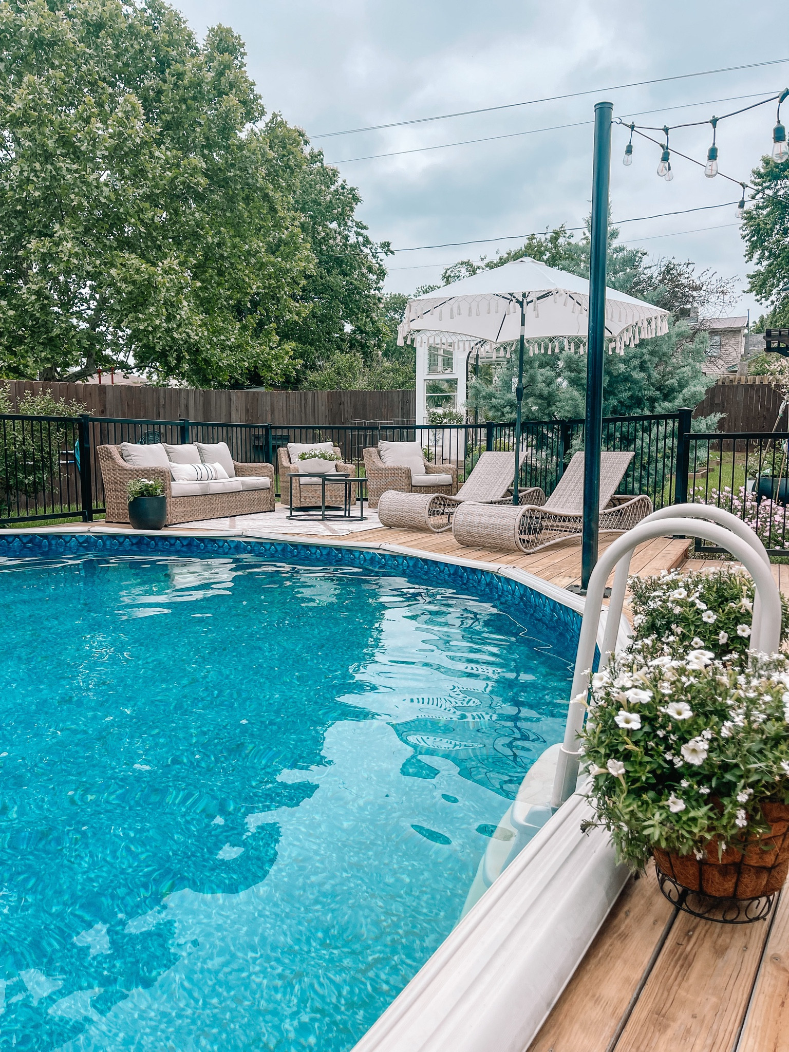 Outdoor patio. Deck decor. Above ground pool. Patio furniture. Planters. Fringe umbrella. Target finds  

#LTKhome #LTKswim #LTKSeasonal