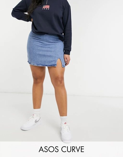 ASOS DESIGN Curve denim slit front mini skirt in midwash | ASOS (Global)