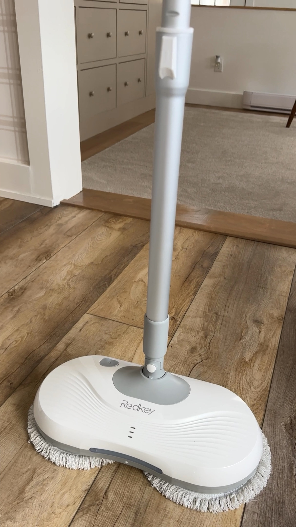 SELF CLEANING electric spin mop on sale right now! so easy to use. you spray and mop. the heads spin. to clean the heads as you mop, put it in the bucket (clean water and soap in the tray) and it spins to clean the mop head and sep the dirty water  