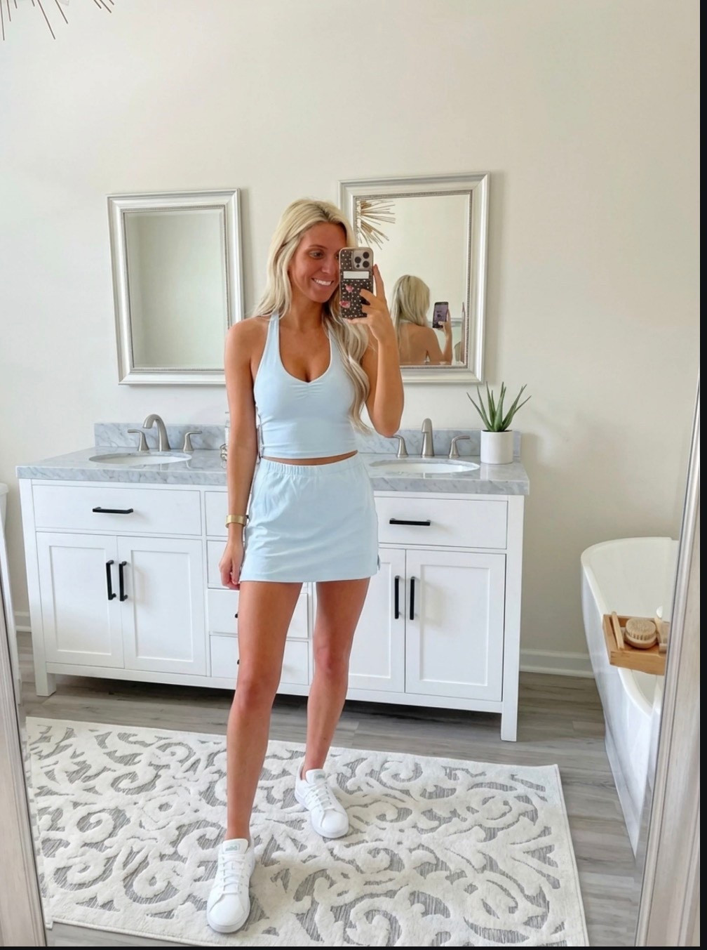 
Bright, lifestyle influencer selfie in a minimalist dressing room mirror. A stylish blonde woman with long beachy waves wears a green and white striped sleeveless polo dress paired with white Adidas sneakers and gold bracelets. The look is sporty-chic and effortless. Neutral dressing room background with soft lighting, clean wood floors, and a relaxed summer vibe. The aesthetic is preppy, travel-ready, and Instagram-worthy — Ralph Lauren meets casual golf resort style. The mood is confident, playful, and polished.

⸻

Caption

Sporty, comfy, and ready for wherever the day goes ✨
This is my favorite kind of outfit — easy, travel-ready, and cute enough for anything from running errands to grabbing lunch or hopping on a flight.

Athleisure but make it preppy chic 💚

— Heidi

⸻

Hashtags

#trendyheidi
#trendywithapassport
#sportychic
#athleisurestyle
#preppystyle
#summeroutfits
#everydaystyle
#adidasstyle
#casualchic
#airportoutfit
#weekendstyle
#tenniscore
#golfstyle
#traveloutfit
#effortlessstyle
#womenwithstyle
#styleinspo
#outfitinspo
#ootdfashion
#everydayfashion
#influencerstyle
#lookbookstyle
#amazonfashionfinds
#casualfashion
#fashionreels


#LTKSpringSale #LTKgrwm #LTKdayinmylife