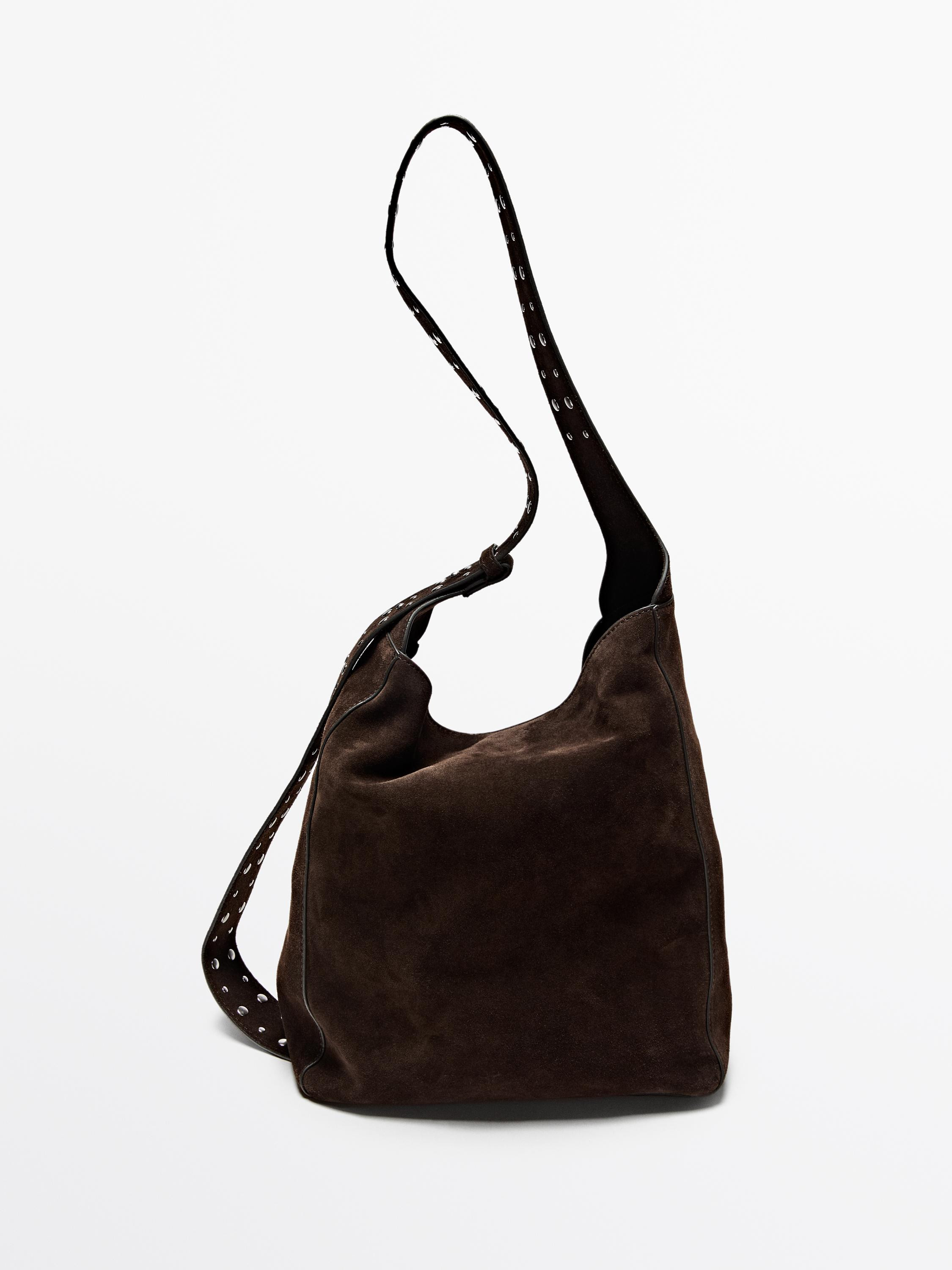 Handbag made of cowhide with a split leather finish. Magnetic snap-button fastening. Adjustable h... | Massimo Dutti UK