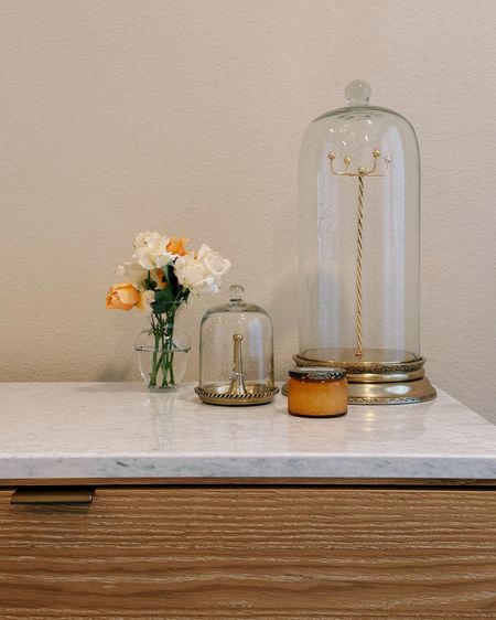 Bedroom details ✨ we just got our new dresser delivered yesterday and I’m in love!! It has 6 spacious drawers & the marble top is so pretty and adds a chic touch to the washed oak finish. I’m starting to style it with some of my favorite things like these cloche jewelry displays, a Voluspa candle, and roses from my mom’s garden 🥰

#LTKHome