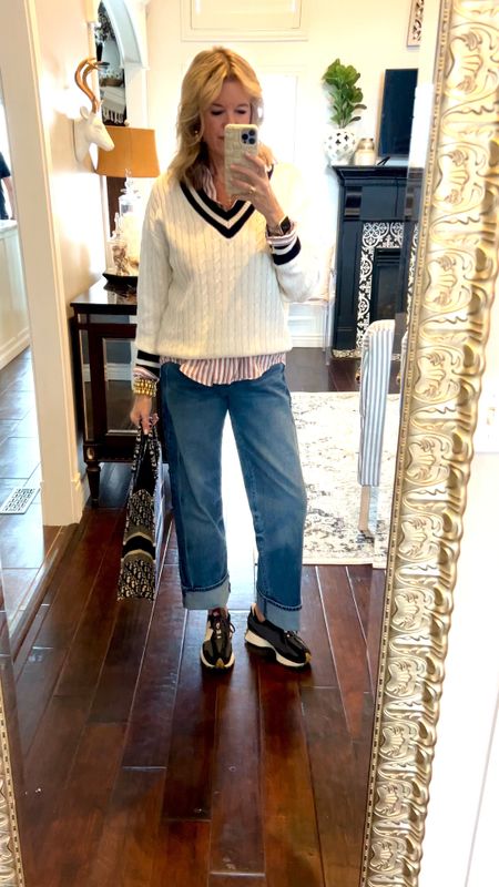 Outfit of the day 
Spring preppy vibe!

Kut from kloth wide leg high waisted large cuff jeans tts

Stripped button up 

V neck white sweater with blue stripe v neck

New balance shoes. 327

Dior tote 

Lisi lurched bracelet stack



#LTKstyletip #LTKover40 #LTKMostLoved