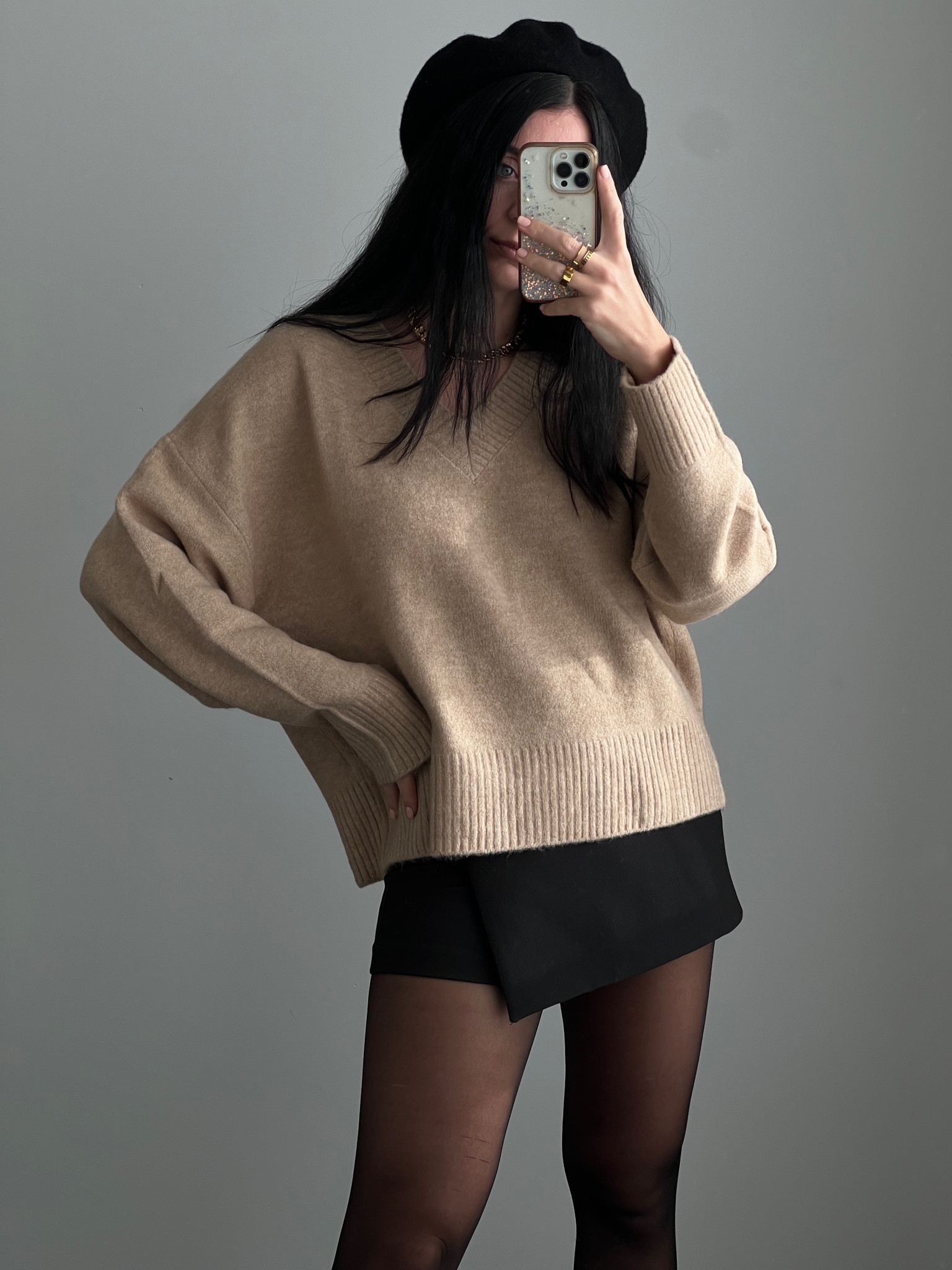 V-neck beige sweater, black skort, and beret winter outfit #beigesweater #skort #beret #winteroutfit 

#LTKSeasonal #LTKGiftGuide #LTKstyletip