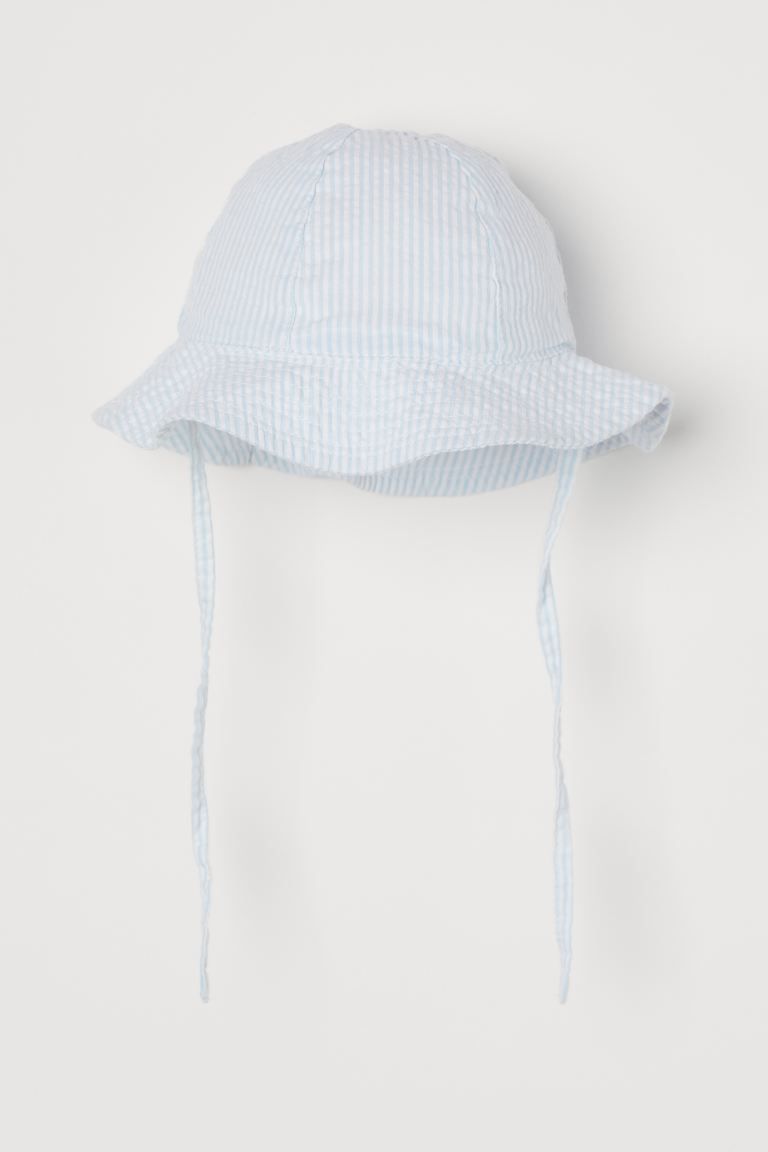 Sun hat in airy, woven cotton fabric. Wavy brim and ties underneath. Lined. | H&M (US)