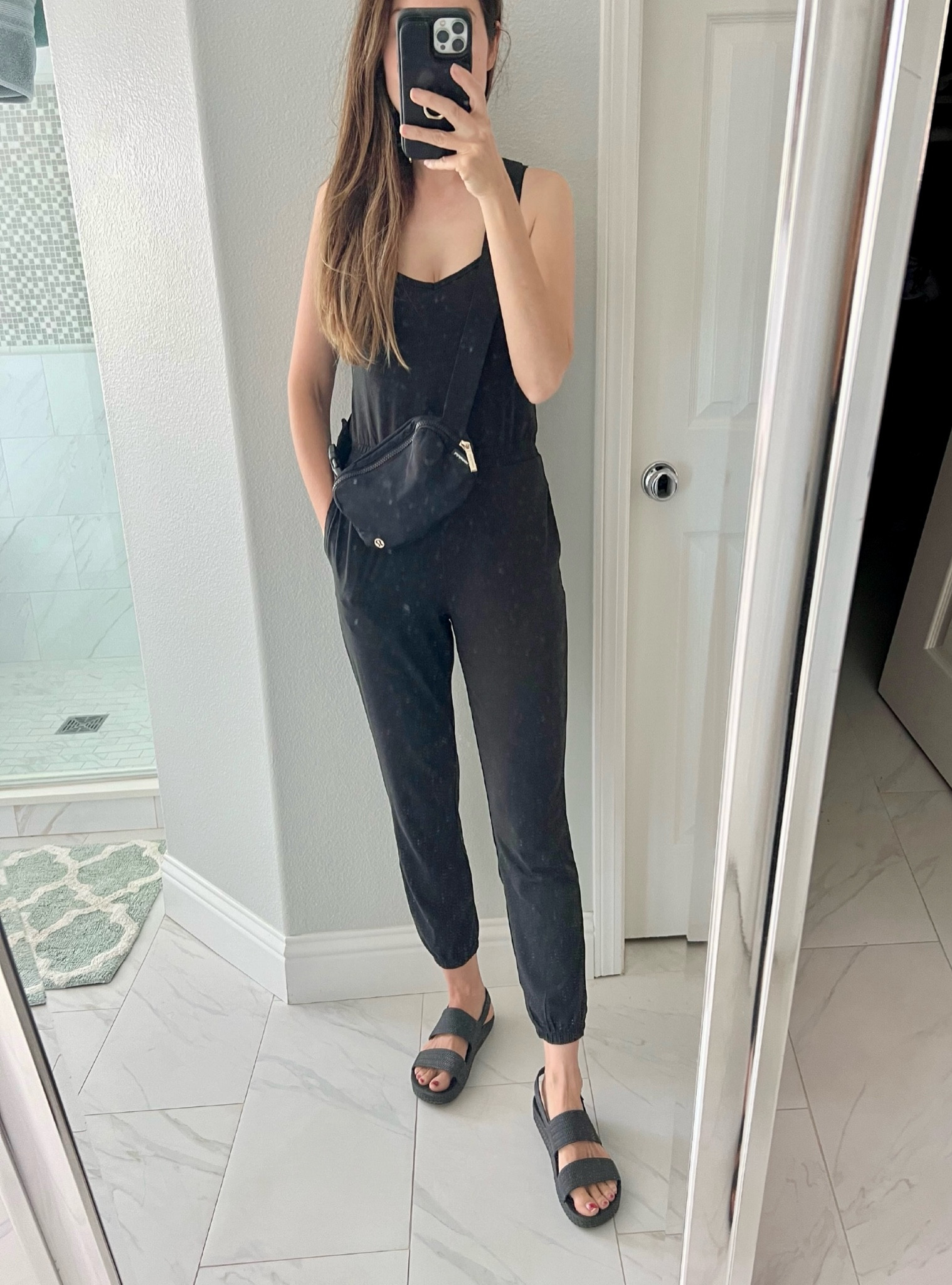 My daily uniform.  Would be a perfect airport travel outfit as well! Love this jogger jumpsuit that is so comfy it feels like I’m wearing pajamas. And I’ve been wearing these sandals everyday since I got them.  They are SO comfy and are waterproof so perfect for the beach or pool.  

Wearing an XS in the jumpsuit and a size 7 in the sandals. Jumpsuit and sandals run true to size 











Tags: lululemon belt everywhere bag, lululemon crossbody bag, vuori jumpsuit, black jumpsuit, casual jumpsuit, airport ootd, outfit of the day, outfit ideas, mom outfit ideas, casual style, casual fashion, everyday outfits, black sandals, black beach shoes, reef water vista sandals, Amazon fashion, athleisure, lounge wear, summer outfits, summer ootd, black bag, black joggers, summer style 

#LTKitbag #LTKshoecrush #LTKtravel