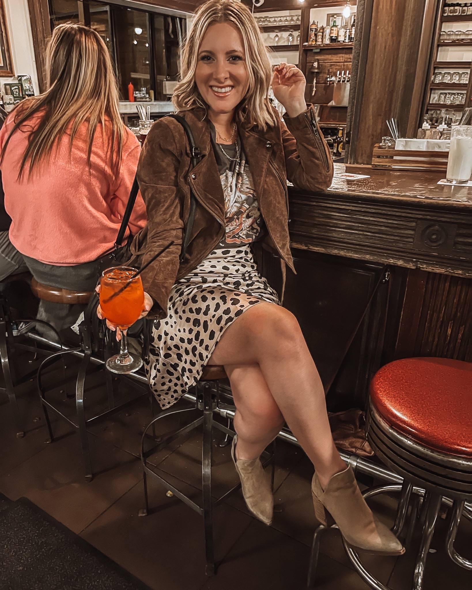 Outfit for going out in Nashville, Queen band tee and leopard spotted skirt, mixing prints and graphic shirts for an outfit, brown suede jacket look, country music concert outfit idea, what to wear to country concert, ootd for broadway Nashville. Suede booties outfit idea, coastal cowgirl,
Western cowgirl look, country concert outfit, country rock outfit. 

#LTKTravel #LTKSeasonal #LTKMidsize