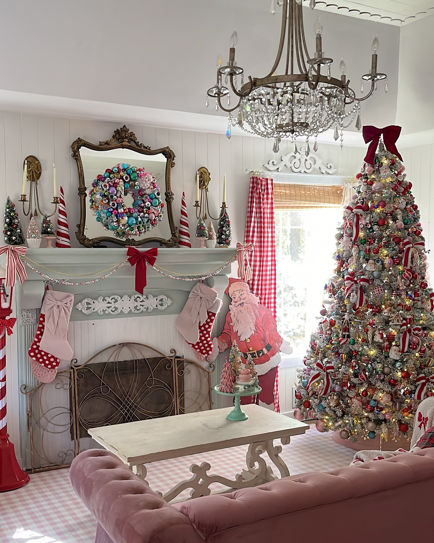 Whimsical Christmas in our living room! No matter how I change things up, I’m always drawn back to pops of red for the holidays. There’s something so warm and nostalgic about the traditional colors mixed with playful pinks and pastels. Our flocked King of Christmas tree is adorned with vintage and vintage-inspired glass ornaments, each one holding memories that my daughters and I have gathered over the years. One of my favorite traditions is bringing out the ornaments and finding those special ones to hang—it brings me back to childhood, searching for my favorite as my mom decorated. Now, I get to share that same joy with my girls, filling our tree with both old memories and new magic each year.

 #WhimsicalChristmas #VintageChristmasDecor #KingOfChristmas #NostalgicHolidays #FlockedTree #HolidayTraditions #CottageChristmas”