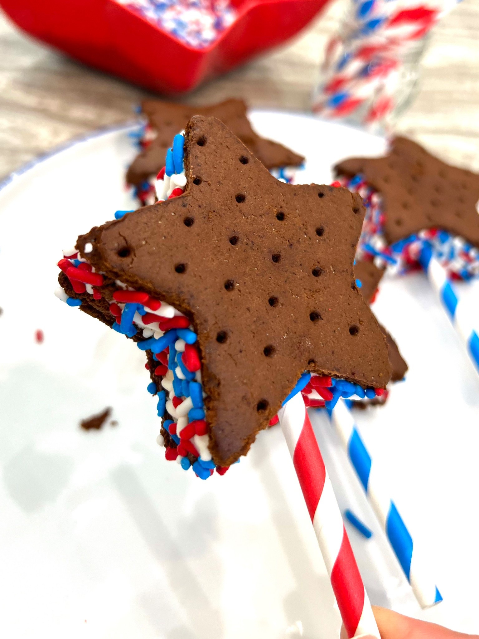 A star cookie cutter and patriotic sprinkles turn classic ice cream sandwiches into a fun Fourth of July theme treat!

#LTKSeasonal #LTKParties
